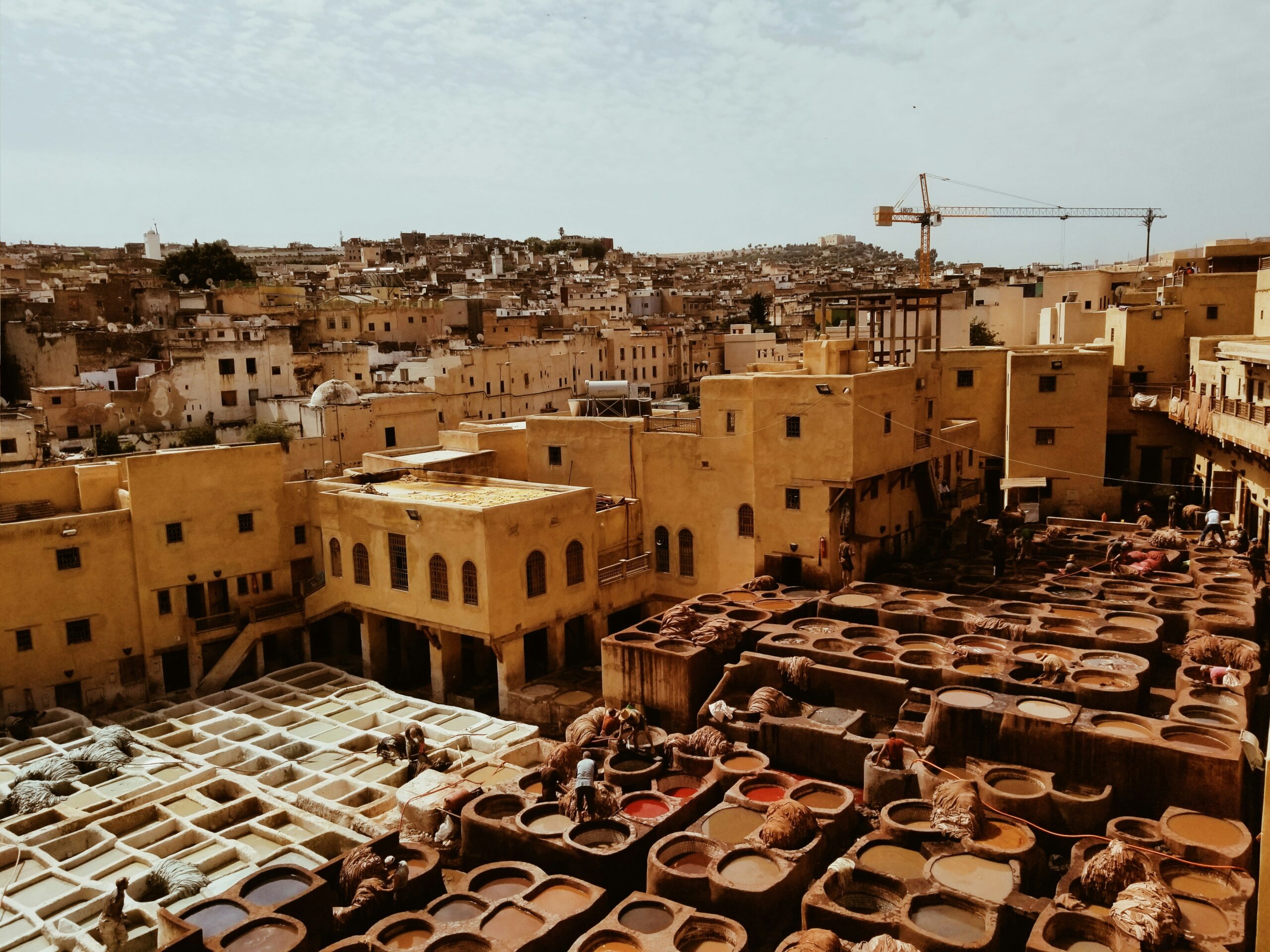 Guided day trip in Fes medina, exploring ancient cultural sites before starting the Fes to Merzouga desert tour